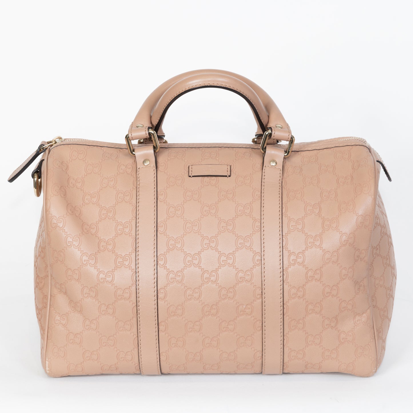 borsa Boston Gucci Joy Guccissima in pelle beige con manici, chiusura zip e logo GG in rilievo.