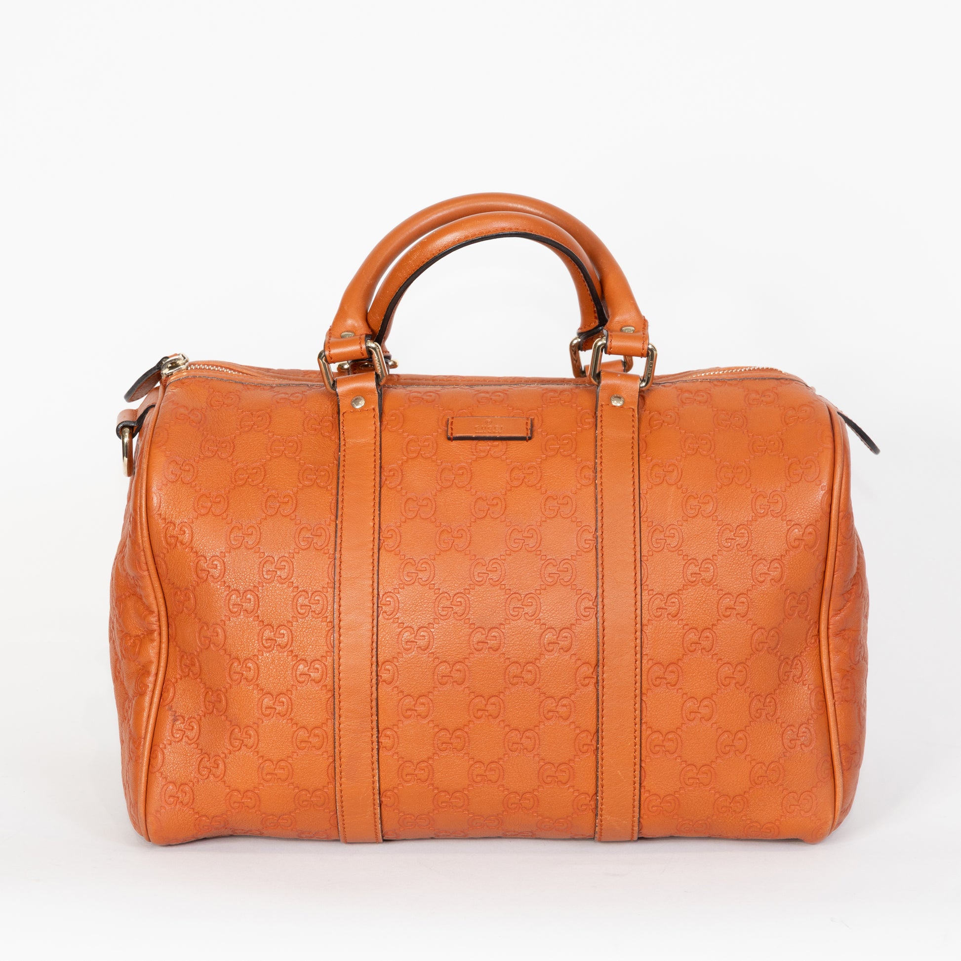 Bauletto Gucci Joy in pelle Guccissima color cuoio con monogramma GG impresso e dettagli dorati.